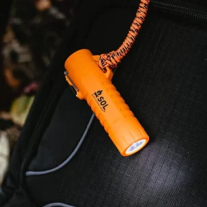 Fire Lite Fuel Free Lighter on backpack with flashlight on