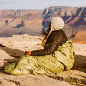 Emergency Bivvy OD Green woman at cliffside2